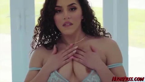 Curvy Latina in sheer lingerie teases huge tits closeup