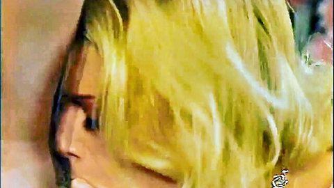 Jenna Jameson profile view with blonde wavy hair, classic porn icon