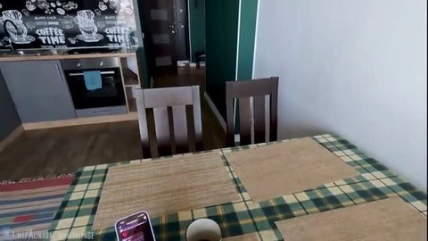 Alina Rai's kitchen table with phone and coffee cup