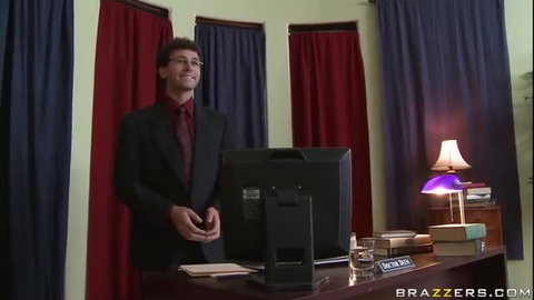 Dr. Deen in suit at desk in Big Cockism Brazzers scene
