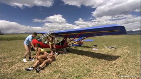 Outdoor group sex foursome with MMFF blowjobs and double penetration near airplane