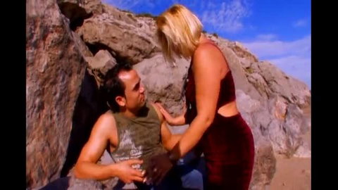 Mature blonde in red dress gives facial after anal on beach