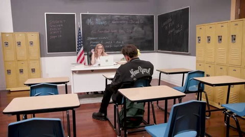 Teacher Adira Allure in classroom with student Victor Ray