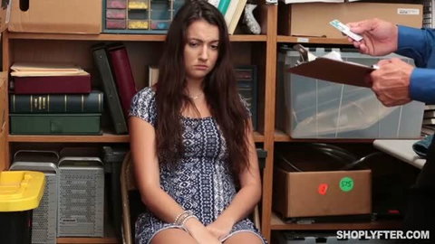 Lily Adams arrested shoplifter with hands cuffed in office