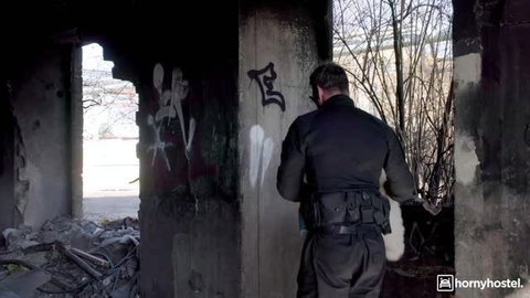 Miss Teela in police uniform exploring abandoned building in naughty hostage roleplay