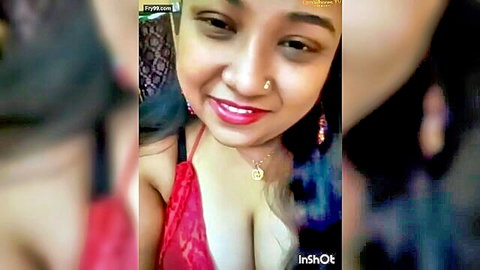 Chubby Desi woman smiling in red lace lingerie with cleavage