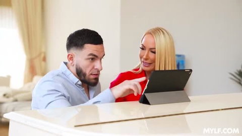 Mellanie Monroe blonde MILF in red top with man looking at tablet