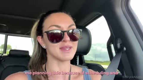 Bryce Adams in car selfie wearing sunglasses and tank top