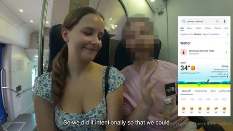 Hermione Potter in low-cut floral top smiling on train with weather overlay