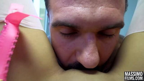 Man performing oral sex on petite Asian woman wearing pink lingerie