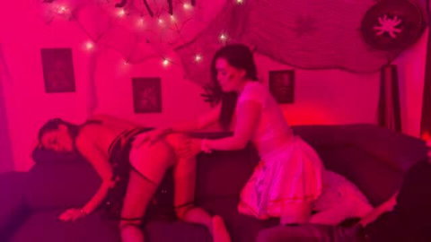 Cataleya and Marinna in pink lingerie, lesbian spanking scene on couch