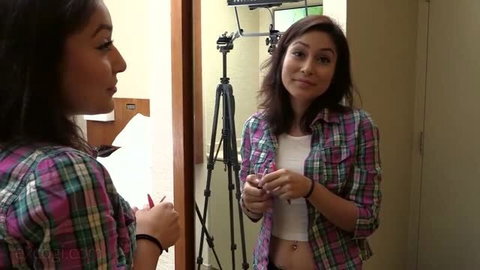 Rosana in pink plaid shirt exposing midriff, Exploited College Girls scene