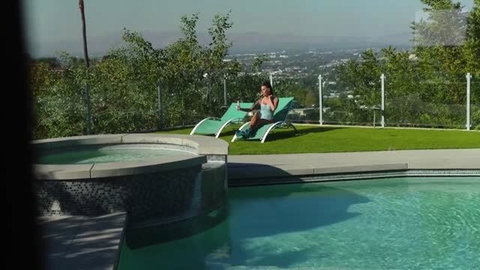 Gia DiMarco in bikini relaxing poolside at luxury villa