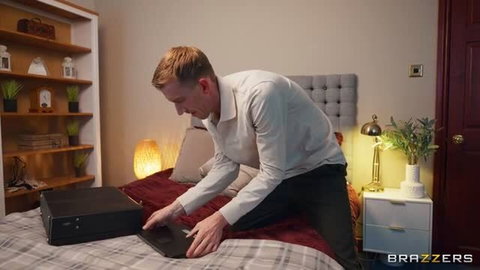 Danny D in white shirt opening laptop on bed - The Power Outage Of Cock Part 1