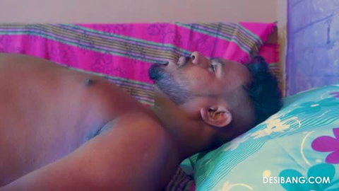 Shirtless Indian man lying in bed, shirtless male torso visible