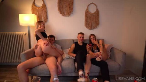 Lis Evans in hardcore group sex scene with multiple partners on couch