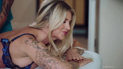 Blonde tattooed MILF Taylor Wild in blue lingerie receiving sensual massage from Victor Ray