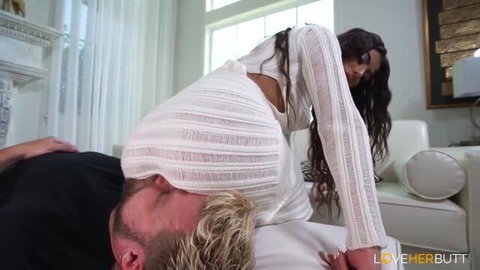 Gal Ritchie in sheer white top facesitting man in close-up adult scene