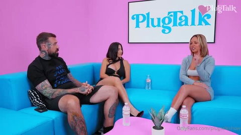 Lena The Plug and Gypsy Rose in black lingerie on blue couch during PlugTalk interview
