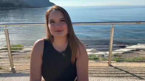 Lily - Young Parisian beauty in black top by the sea