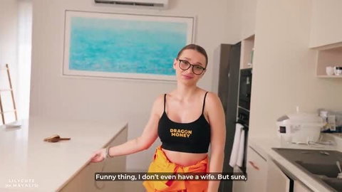 Lily Cute wearing glasses and black crop top in kitchen, softcore tease