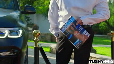 Stefany Kyler on VOGUE cover held by man in white shirt, outdoor luxury setting