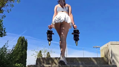 Passionsecret07 in mini skirt carrying roller skates on stairs