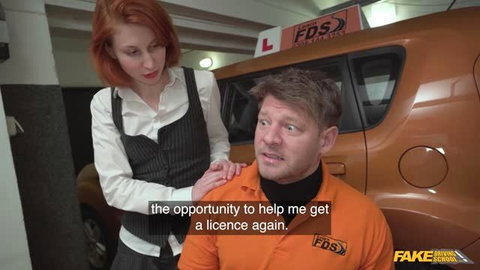 Jacky Liz Hyde in vest and white shirt comforts Michael Fly in orange FDS driving school uniform