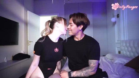 Asian guy and blonde Russian girl intimate on bed