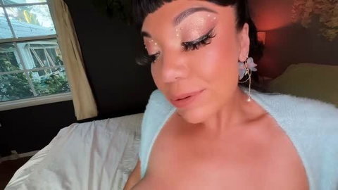Little Puck in seductive makeup and towel, close-up selfie