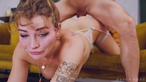 Emma Vai tattooed blonde in micro bikini getting fucked from behind on yellow couch