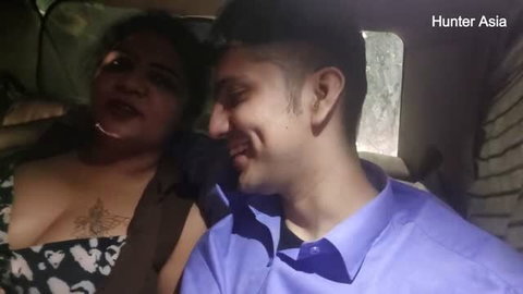 Hunter Asia in car backseat with guy, cleavage visible