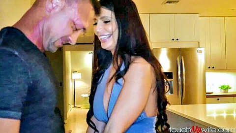 Brunette MILF with huge tits in blue dress flirts intimately with older man in kitchen