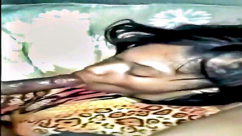 Amateur black woman with long hair sucking massive BBC deeply