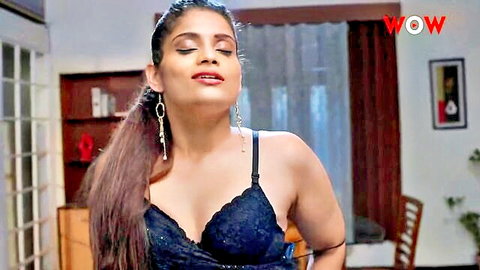 Seductive Indian woman in black lace bra teasing with deep cleavage and big tits