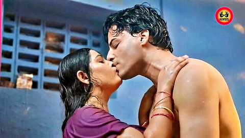 Passionate wet kiss between Indian couple, man shirtless embracing woman in purple sari