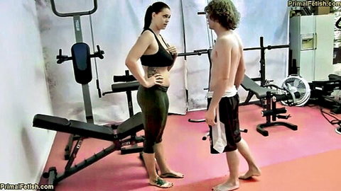 Alison Tyler in tight sports bra and leggings teasing fit guy in gym