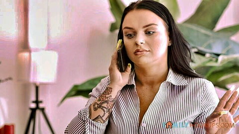 Payton Preslee on seductive phone call, unbuttoned striped blouse showing cleavage